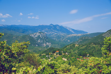 Greek Republic. Fields and mountains, grass and trees. In the distance mountains and sky. 13. Sep. 2019.