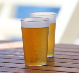Two glasses of beer on the table