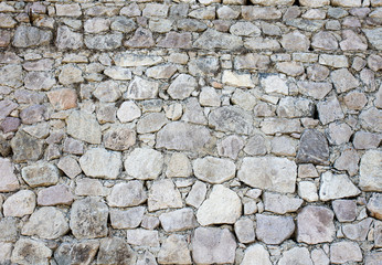 Wall of stone blocks as an abstract background