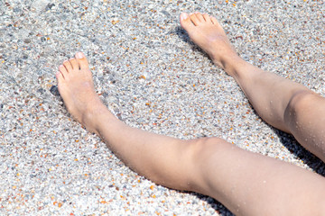 Feet of a girl sunbathing in the sun