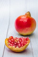 Pomegranate fresh fruit on wood white background.