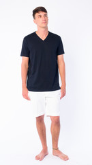 Fototapeta premium Full body shot of young handsome man thinking