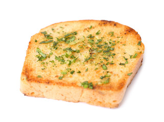 Slice of bread with garlic and herbs on white background
