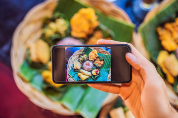 Taking photo of food with smartphone , mobile photographer