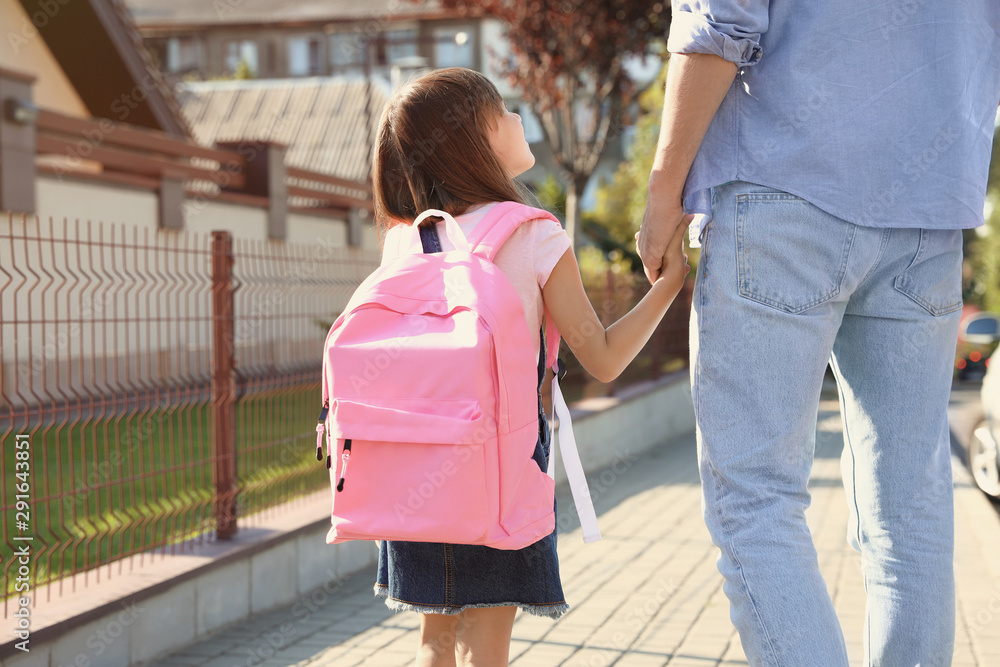 Canvas Prints Father taking his little child to school on street