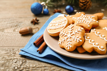 Tasty homemade Christmas cookies on wooden table, closeup