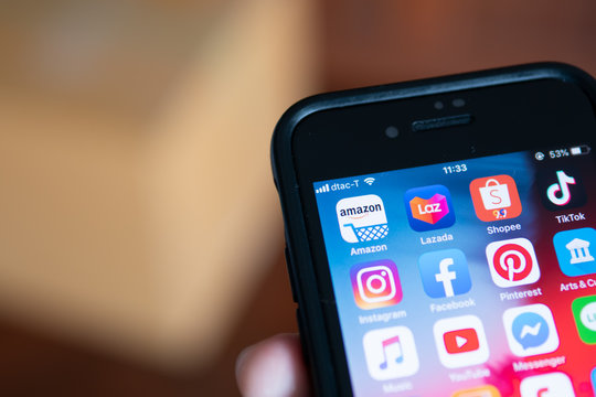 Bangkok, Thailand - August 22, 2019 : iPhone 7 showing its screen with Amazon and other online shopping application icon.