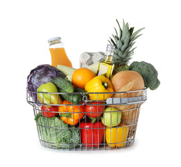 Shopping basket with grocery products on white background