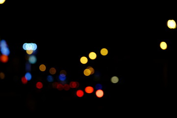 Abstract blurred of blue and silver glittering shine bulbs lights background:blur of Christmas wallpaper decorations concept.christmas light night