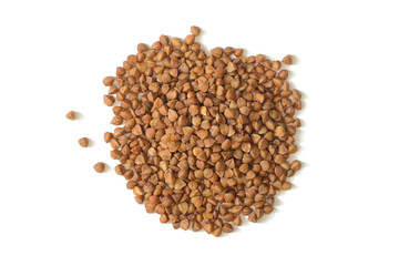 A bunch of raw buckwheat grains on a white background