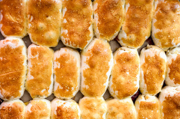 Hot cakes stuffed on a baking sheet