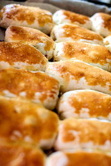 Hot cakes stuffed on a baking sheet