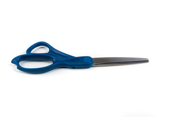 Blue handled pair of metal scissors on a white background