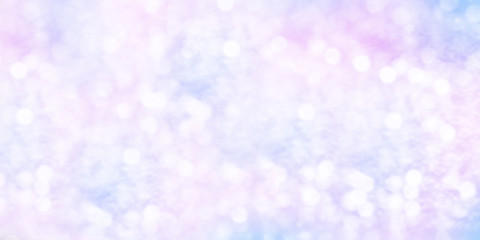 Winter shiny snowflakes blurred background in light blue pink colors
