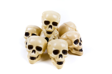 Bone white plastic skull  figures on a blank background