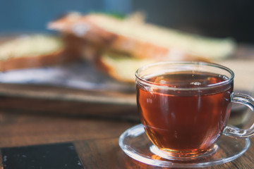 cup of tea at a cafe blurred background and garlic bread.