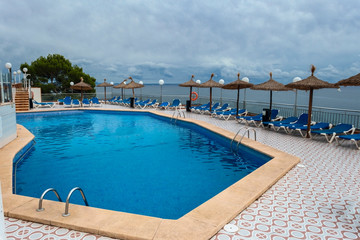 Fototapeta na wymiar pool with crystal clear water in a recreation area on the Mediterranean coast