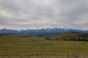 Naklejka premium Snow top in Altai mountains. Bottom view. Summer travel concept. Long shot.