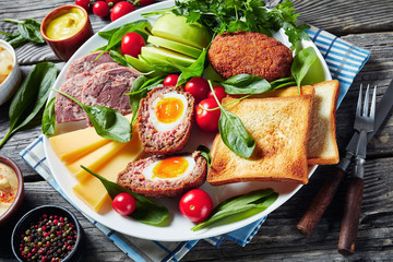 plowman's lunch on a white plate, close-up