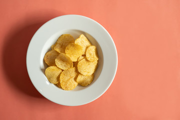 Potato chips on white dish