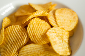 Potato chips on white dish