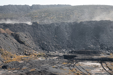 Geological section of soil, layers of coal and rock. Overburden open mine anthracite. Dark texture black color