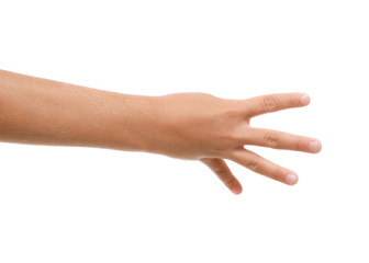 Child's hand showing four fingers on white background