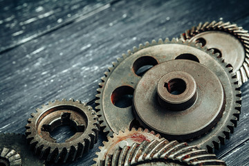 Car parts gears and bearings on wooden background