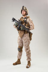 United states Marine Corps special operations command  raider with weapon. Studio shot