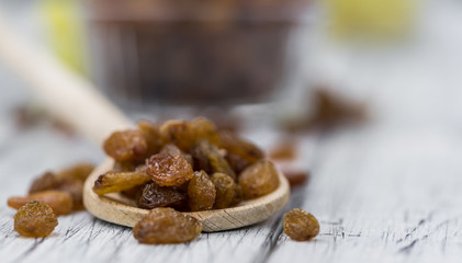 Portion of healthy Raisins (selective focus; close-up shot)