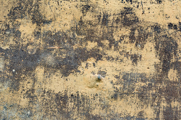Texture of a concrete wall with cracks and scratches which can be used as a background