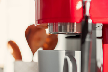 Kitchen utensils in cup on table close up