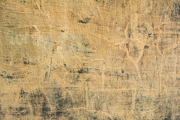 Texture of a concrete wall with cracks and scratches which can be used as a background