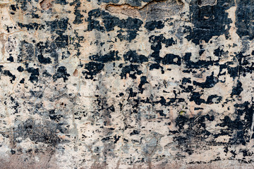 Texture of a concrete wall with cracks and scratches which can be used as a background