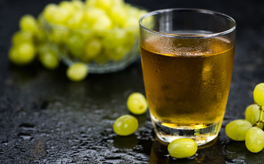 Grape Juice (fresh) as detailed close-up shot, selective focus)