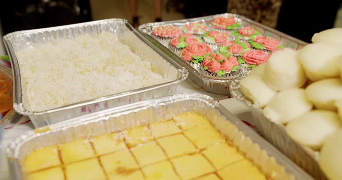 Trays of mostly Filipino desserts, including Pichi Pichi, Cassava cake custard and Puto