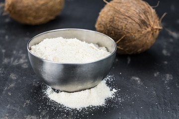 Fototapeta na wymiar Portion of Coconut flour as detailed close-up shot; selective focus