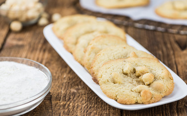 Some fresh Cookies on wooden background (selective focus; close-up shot)