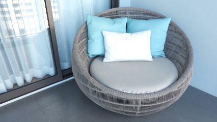 Fototapeta na wymiar Outdoor beach chair on the hotel room balcony or terrace which made from natural wood called rattan and brown color round shape and look luxury for relaxing or sleeping or for party.