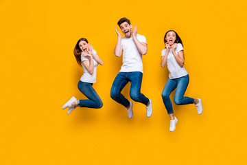 Fototapeta na wymiar Full length body size view portrait of three nice attractive lovely cute slim fit cheerful cheery glad excited person having fun isolated over bright vivid shine yellow background