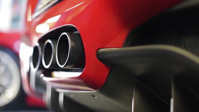 Red car modern design three exhaustion pipes