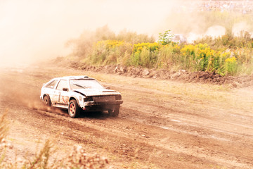 Plakat Car on dirt track. Racing cars in the fresh air with dust. One car leads the race, breaks ahead to victory.