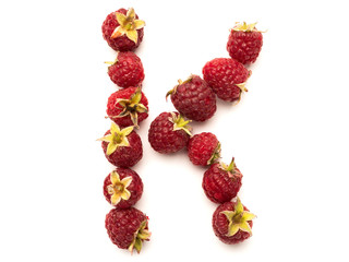 Isolated alphabet letter lined with fresh raspberries