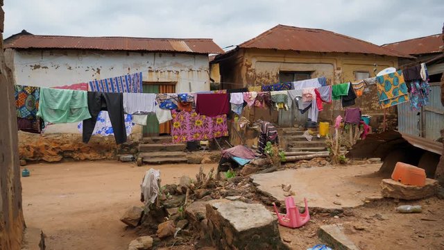 Clothes line next to small houses in a slum near Atakpame, Togo.