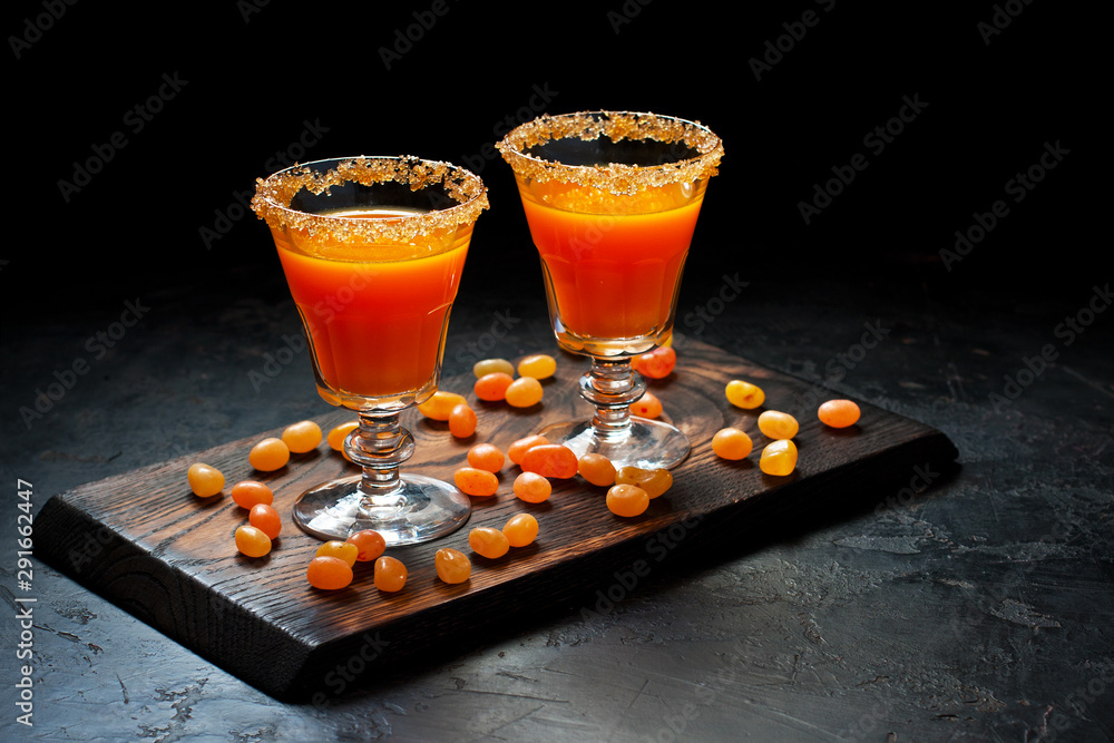 Wall mural pumpkin orange cocktail in glass. fall seasonal drinks