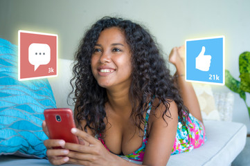 internet social media app likes and chat comments icons composite on young beautiful and happy...
