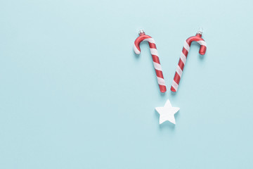 Christmas, New Year or Noel holiday festive winter greeting card with decorations on blue background, flat lay composition, top view