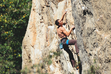 Man climbing a rock. 