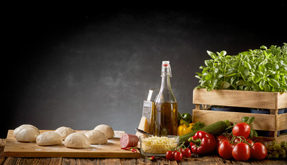 Fresh organic ingredients for an Italian pizza