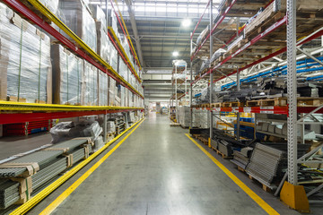 Factory warehouse steel reinforcement. High stacked shelving.